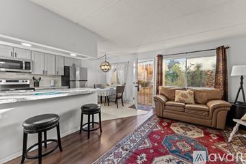 Wickenburg apartment for rent - A kitchen with white cabinets and a black fridge is shown.