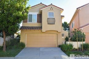 Camarillo house for rent - A house with a brown garage door is for sale.