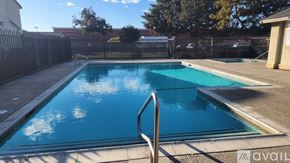 Modesto townhouse for rent - A small pool with a metal ladder in the middle.