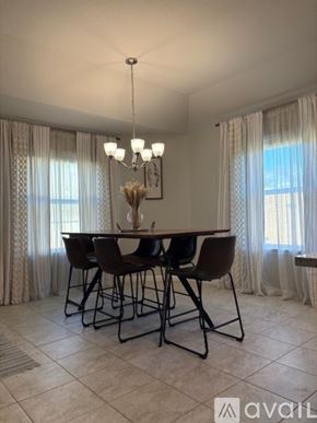 Burnet house for rent - A dining room with a table set for four.