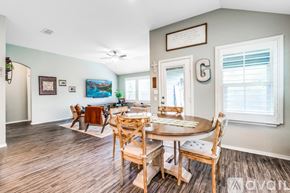 Schertz house for rent - A dining room with a wooden table and chairs.