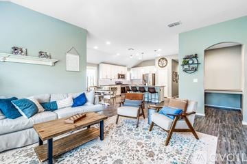Schertz house for rent - A living room with a white couch and a wooden coffee table.