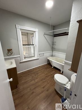 Gardner apartment for rent - A bathroom with a toilet, sink, and bathtub.