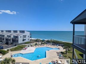 North Topsail Beach condo for rent - A large swimming pool with a view of the ocean.