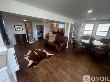 Narragansett house for rent - A living room with a cowhide rug on the floor.