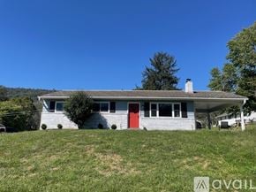 Knoxville house for rent - A house with a red door is for sale.