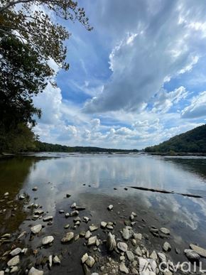 Knoxville house for rent - A body of water surrounded by trees and rocks.
