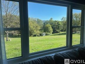 Knoxville house for rent - A modern kitchen with wooden floors and white appliances.