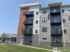 Minneapolis apartment for rent - Apartment building with balconies and multiple windows.