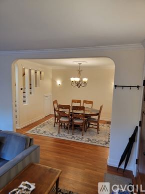 Sacramento townhouse for rent - A dining room with a wooden table and chairs.