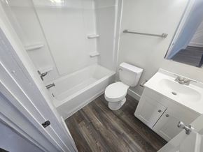 Lima house for rent - A white toilet sits next to a sink in a small bathroom.