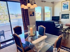 Scottsdale condo for rent - A modern dining room with a glass table and chairs.