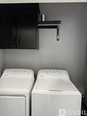 Edinburg apartment for rent - Two white front loading washing machines in a laundry room.