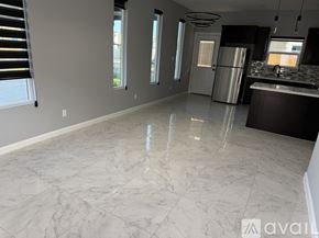 Edinburg apartment for rent - A kitchen with a marble floor and a refrigerator.