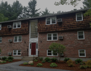 Litchfield apartment for rent - A red brick building with a white door and windows.