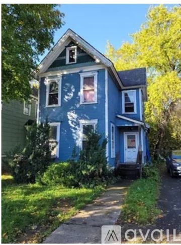 Syracuse apartment for rent - A blue house with a white door and windows.