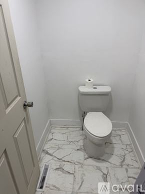 Syracuse apartment for rent - A room with a door and carpeted floor.
