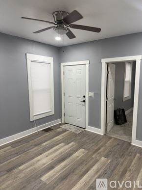 Syracuse apartment for rent - A room with grey walls and a window.
