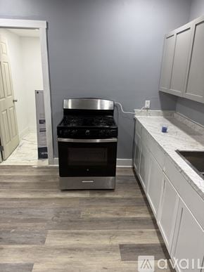 Syracuse apartment for rent - A white door is in a room with grey walls.