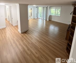 Alexandria condo for rent - A gym with a variety of equipment including treadmills, weights, and benches.
