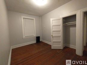 Baltimore apartment for rent - A small bathroom with a toilet and a window.