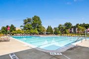 Silver Spring apartment for rent - A swimming pool with a clear blue sky above it.