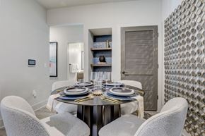 Venice apartment for rent - A modern dining room with a round table set for four.