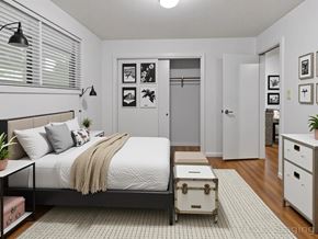 Washington apartment for rent - A bedroom with a bed, nightstand, and a cabinet.