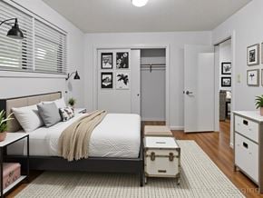 Washington apartment for rent - A bedroom with a bed, nightstand, and a cabinet.