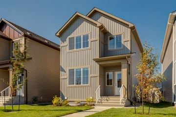 Edmonton apartment for rent - A modern house with a grey facade and a large front porch.