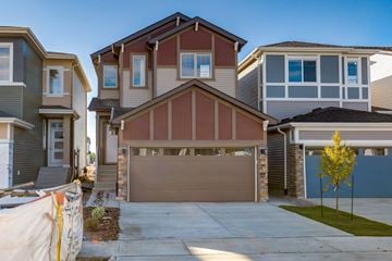 Beaumont apartment for rent - A row of houses with garages in front.