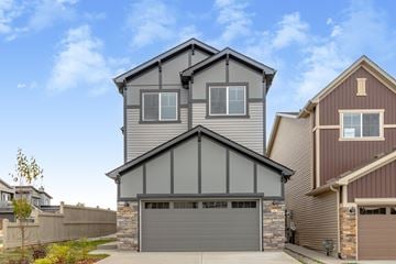 Edmonton apartment for rent - A modern two-story house with a garage is shown.
