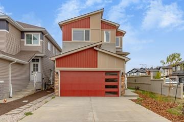 Edmonton apartment for rent - A modern house with a red garage door.