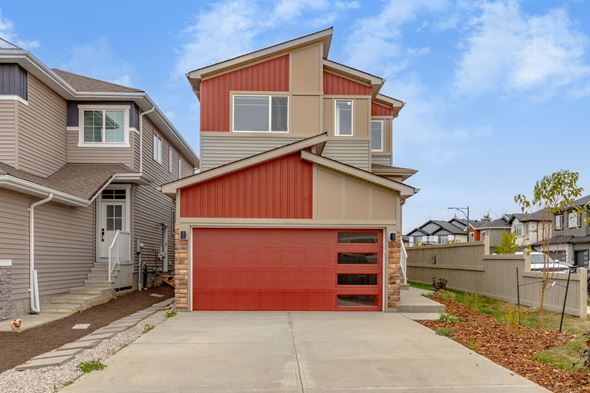 Edmonton apartment for rent - A modern house with a red garage door.