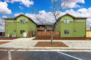 Chico apartment for rent - A green house with a tree in front of it.