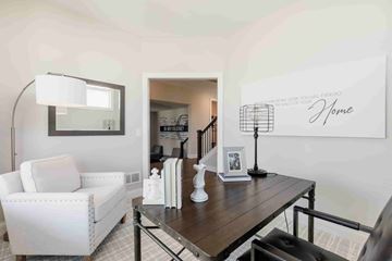 Hastings house for rent - A living room with a white sofa and a wooden coffee table.