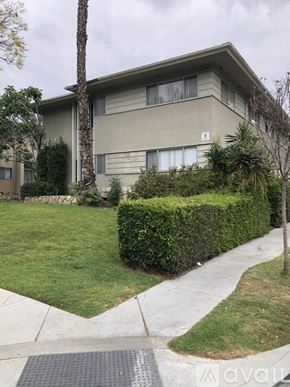 Glendale apartment for rent - A beige apartment building with a green lawn in front.