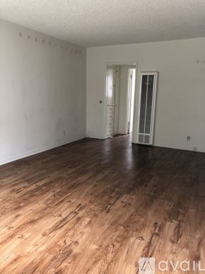 Glendale apartment for rent - A room with wooden flooring and white walls.