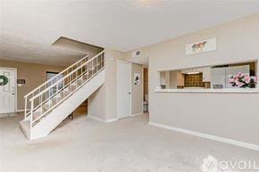 Seabrook house for rent - A spacious room with a staircase and a reception desk.