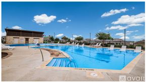 New Braunfels house for rent - A large outdoor swimming pool with a sign that says "SPF IS ONLY RECOMMENDED".