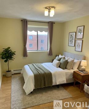 Winthrop apartment for rent - A living room with a television, two chairs, a sofa, and a coffee table.