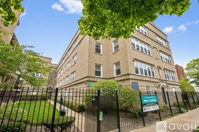Chicago apartment for rent - A building with a sign that says "Now Listing" in front of it.