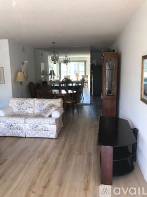 Clearwater condo for rent - A living room with a couch, chair, and coffee table.