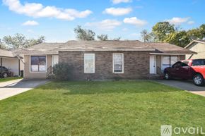 Belton house for rent - A kitchen with wooden floors and white appliances.