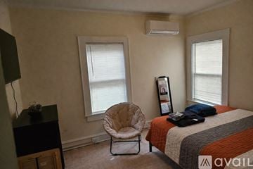 Scranton apartment for rent - A living room with a couch, a coffee table, and a painting on the wall.