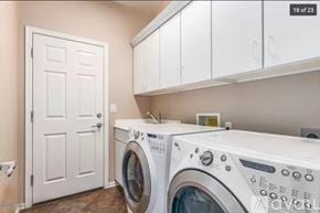 Phoenix house for rent - A white door is next to a washer and dryer in a laundry room.