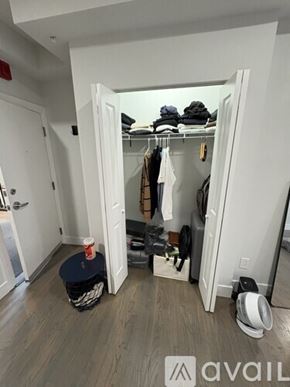 Boston apartment for rent - A room with a white door and a shoe rack with shoes hanging on it.