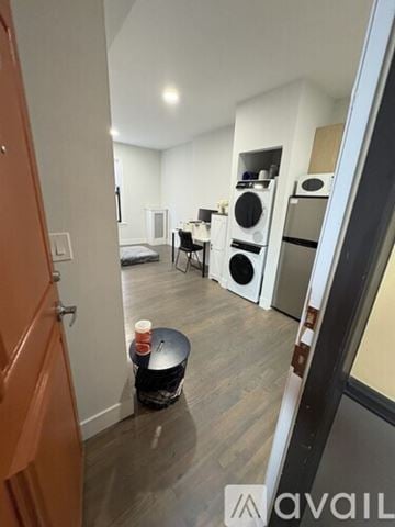 Boston apartment for rent - A kitchen area with a table and chairs in the middle of the room.