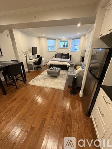 Boston apartment for rent - A well-lit, spacious kitchen and living room with hardwood floors and modern appliances.