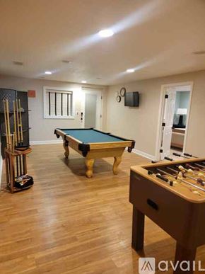 Vine Grove apartment for rent - A room with a pool table and a foosball table.
